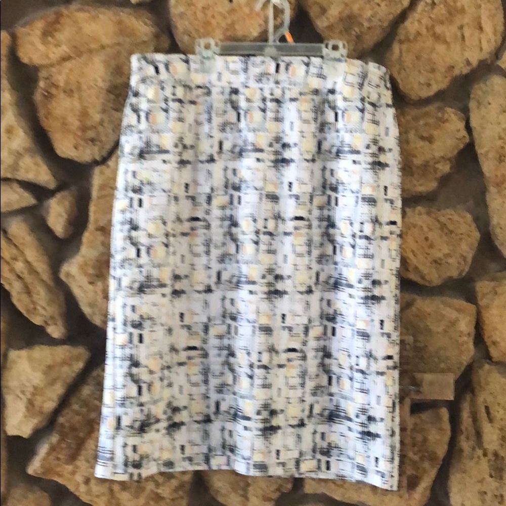 Pattern skirt with black, yellow and tan colors.
